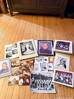 Overall view showing majority of photographs spread on floor