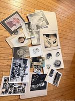 Spread of all photographs on floor showing quantity and variety