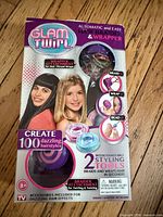 Front of Glam Twirl sealed retail box displaying product images and features