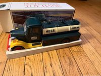 Hess tanker truck bank on foam insert with box behind