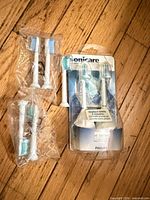 Front view showing blister pack of two Philips Sonicare e-series heads and two factory-bagged pairs