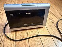 Front view showing RCA logo, display panel and 3-band marking