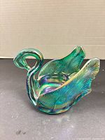 Front view of iridescent art glass swan bowl