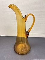 Full front view of amber glass pitcher