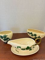 Gravy boat on plate with two planters