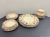 Entire 25-piece Myott dinnerware set arranged on surface