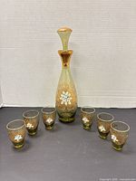 Full set showing decanter with stopper and six shot glasses