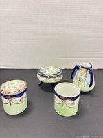 Full group view of all four porcelain vanity pieces