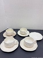Four cup-saucer sets plus extra saucer showing full lot