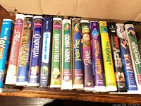Row of Disney clamshell DVDs showing titles