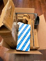 Top view of box showing various boxed automotive parts