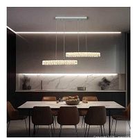 Lifestyle view of crystal LED pendant over dining table