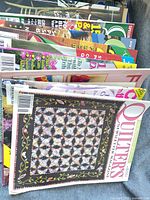 Stack of quilting magazines showing variety of titles