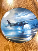 Front view of plate showing Harrier jet artwork
