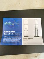 Instruction sheet showing assembled sign stand and specifications