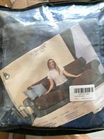 Packaging showing Subrtex branding and sofa slipcover image
