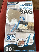 Front of damaged Cozy Essential vacuum storage bag box showing product details and missing pump note