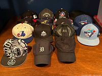 All 15 caps arranged in rows