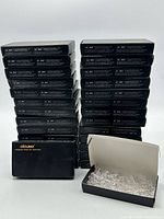 Stack of 28 branded cartons plus one open showing LEDs