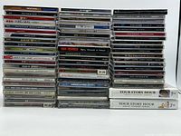 Full front view of three stacks of CDs