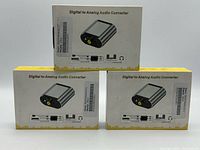 Front view of three boxed converters