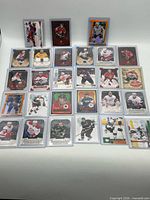 Overview of all 27 serial-numbered cards in sleeves