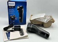 Shaver with box, charger, manual, cap and tray