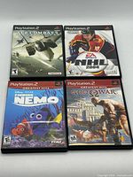 Front covers of the four PlayStation 2 game cases