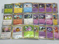 Front of binder page showing first 18 Pokémon cards