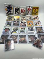 Full layout of approximately 23 hockey and Sopranos cards