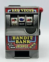 Front view showing reels, graphics and coin slot