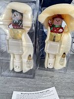 Both night lights in packaging with foam and bulbs visible