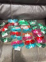 all 30 pairs of sunglasses spread on couch