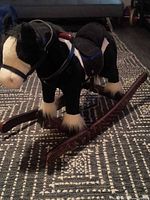 Left side view of plush rocking horse on wooden rockers