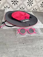 Hat and sunglasses in packaging