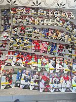 Full spread of roughly 60 Upper Deck Tim Hortons hockey cards laid out on table