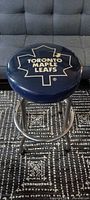 Full view of Toronto Maple Leafs vinyl padded bar stool showing seat logo and chrome frame