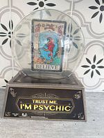 Front of sealed Trust Me, I’m Psychic game showing crystal-ball packaging and title