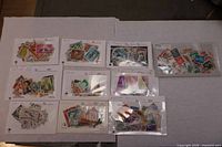 All ten stock cards laid out, each filled with mixed stamps