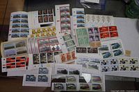 Overview of numerous plate blocks laid out, showing variety of themes and countries