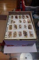 Box with binders and visible card pages