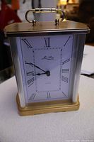 Front view of Jean Louis carriage clock showing dial and case