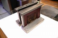 Pair of fireplace-form nickel-plated cast iron bookends, angled side view