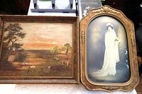 Both framed pieces side by side on table