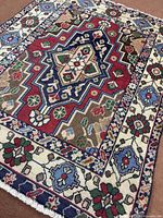 Full view of Bakhtiyar rug showing entire design and borders