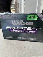 Front view of sealed Wilson Pro Staff Women's Distance 15-pack golf ball box