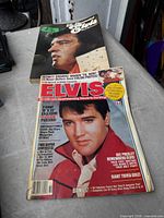 Both Elvis magazines front covers visible