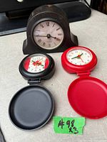 All three clocks displayed open to show faces and condition