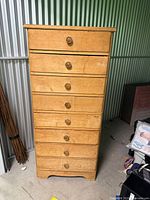 Front view of tall 8-drawer wooden dresser