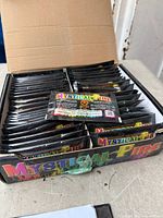 Open box showing many sealed Mystical Fire packets
